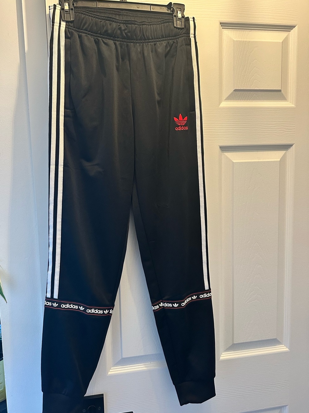 Youth adidas Black Joggers with White Side Stripes and Red Trefoil